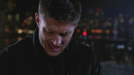 Dean winces in pain as he looks at his new mark.
